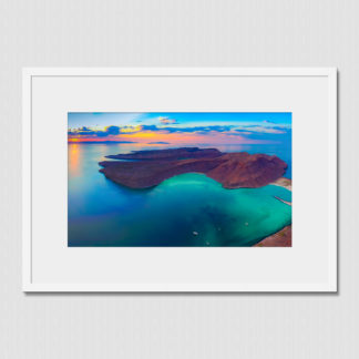 Aerial panoramic of stunning sunset colors overlooking clear blue water between Caleta Partida and Espiritu Santo, Mexico.