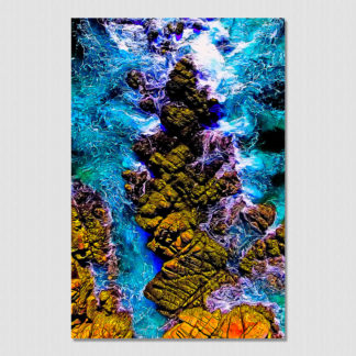 Close aerial view of waves crashing on unique rock formations at Bahia Organo, Huatulco, Mexico