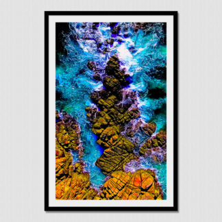 Close aerial view of waves crashing on unique rock formations at Bahia Organo, Huatulco, Mexico