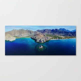 High elevation aerial photo of majestic mountain range and stunning water front in Aqua Verde Bay, Baja, Mexico