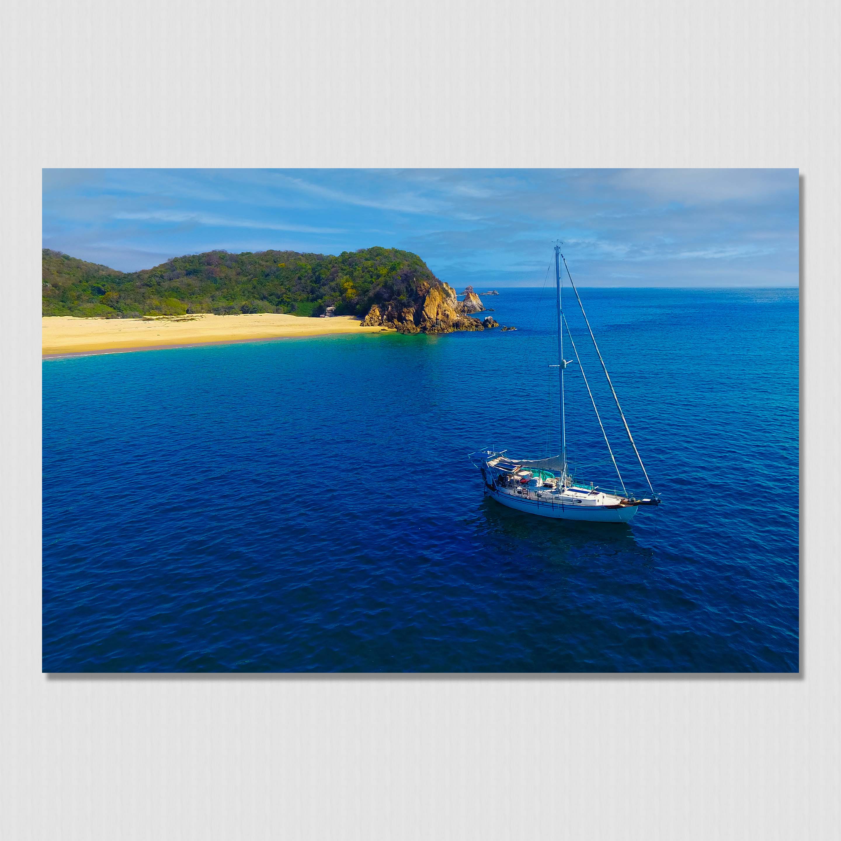 Living the dream on a sailboat anchored near paradise island beach cove.