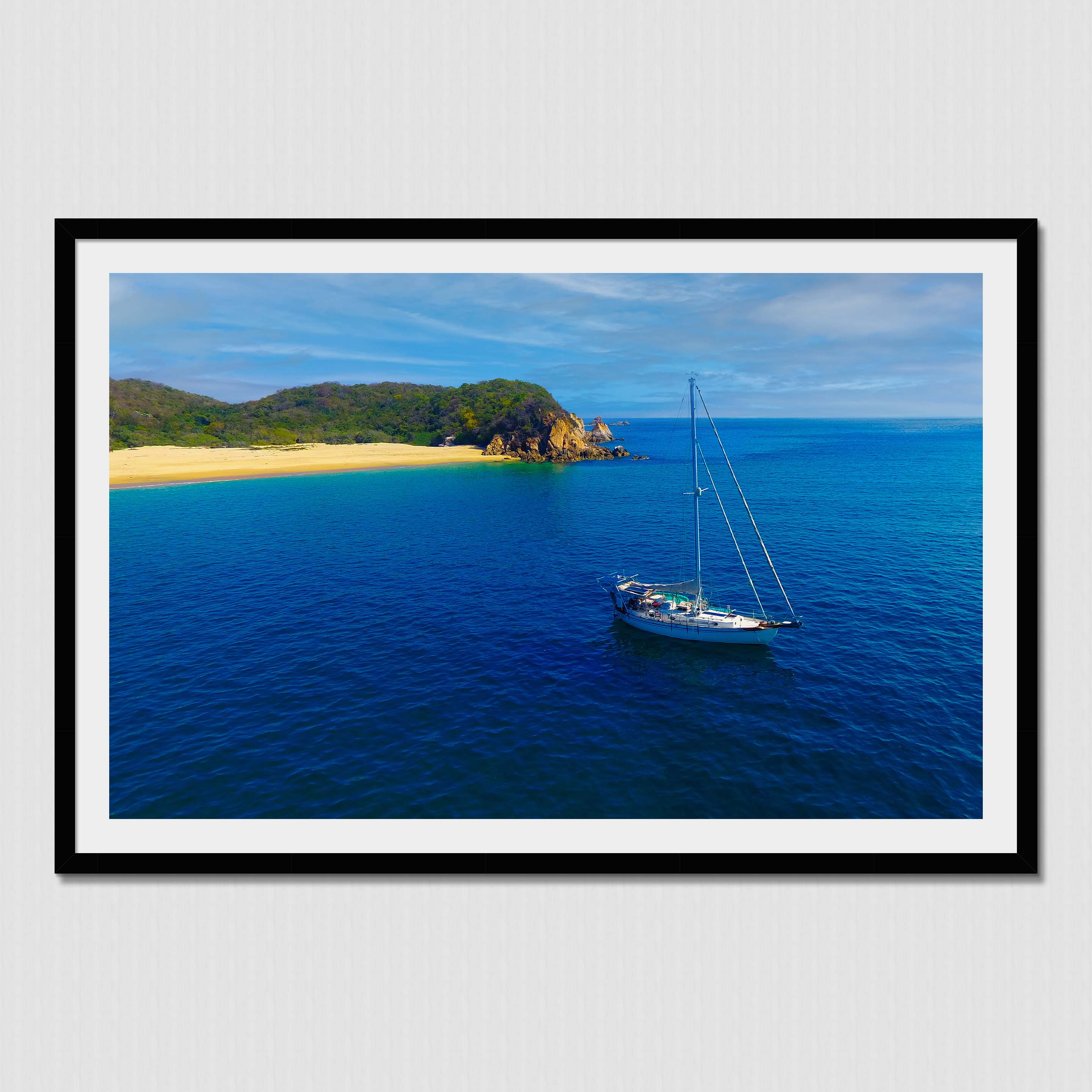 Living the dream on a sailboat anchored near paradise island beach cove.