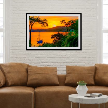 Iconic golden sunset and sailboat with oil paint effect in the calm Dolphin Bay, Bocas Del Toro, Panama